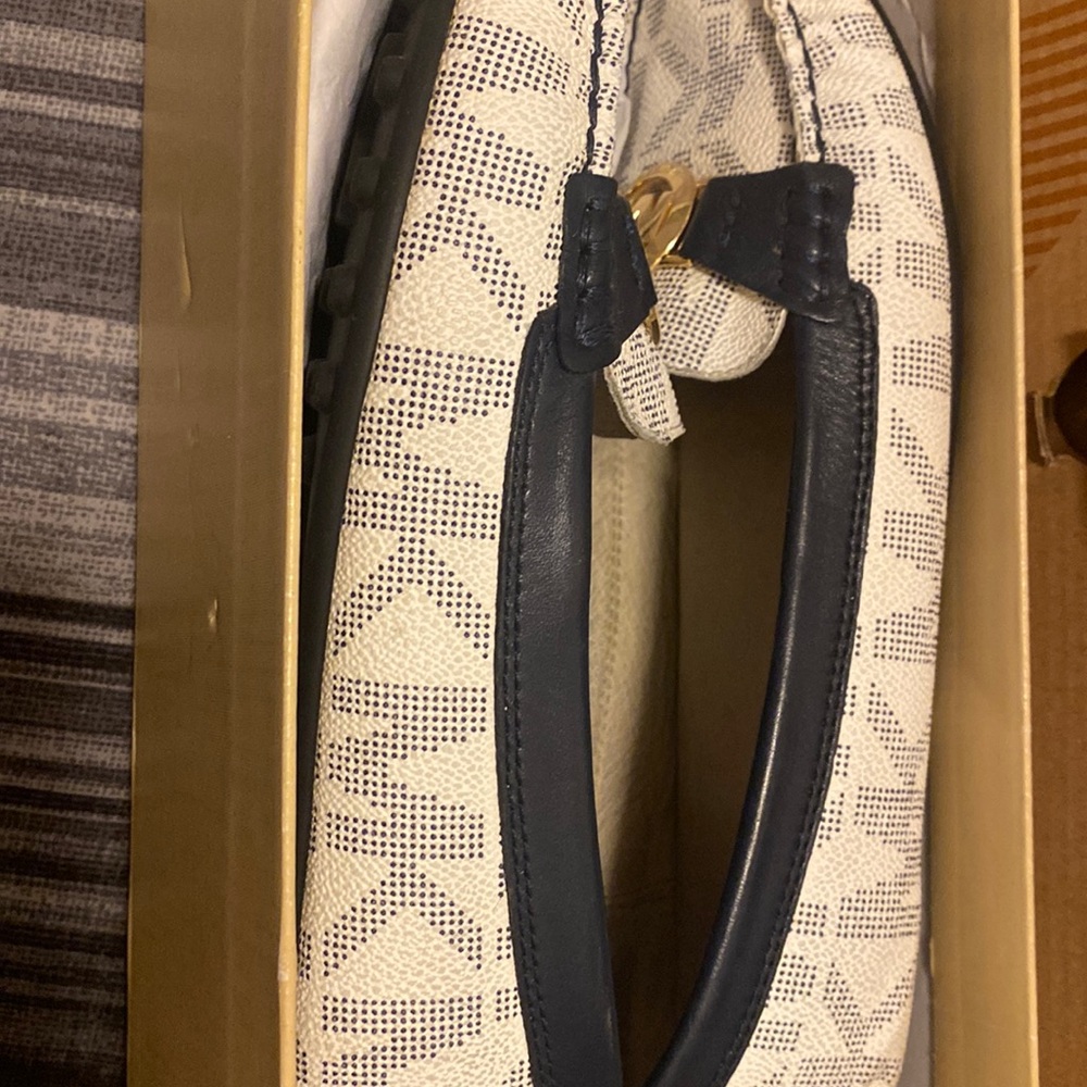 Michael Kors loafers to complete the business casual look